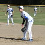 Second baseman Jon Bartel, left, first baseman Nick Young and right fielder Luke Rookstool get ready to play defense.(Photo by Jim Waller/Sound Whidbey Record)
