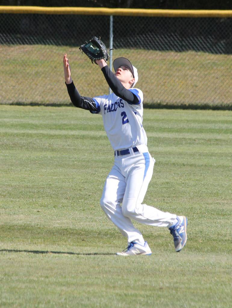 Right fielder Luke Rookstool settles under a fly ball.(Photo by Jim Waller/Sound Whidbey Record)