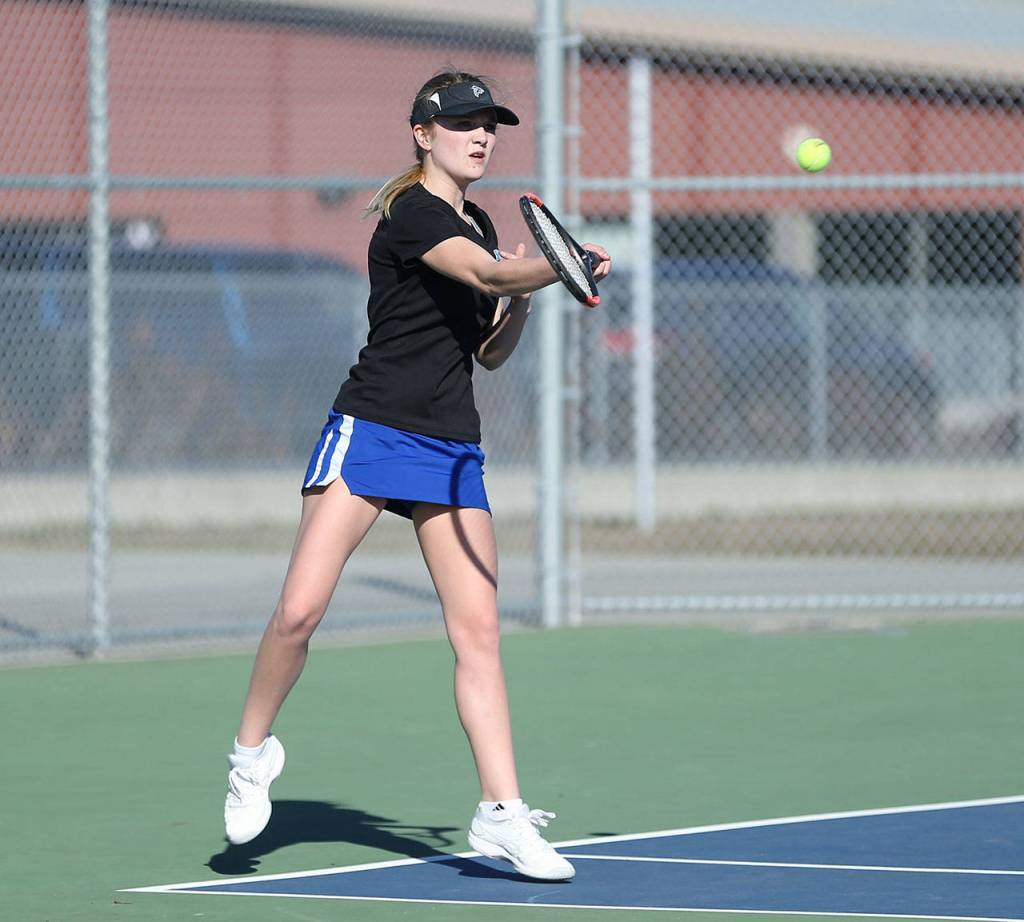 McKenna Kelley returns a shot in second doubles.(Photo by John Fisken)