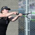 Oliana Stange hits a high hard one.(Photo by John Fisken)