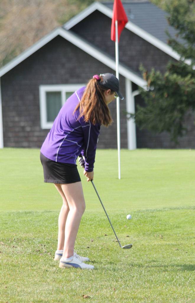 Tori Schuller chips toward the pin.(Photo by Jim Waller/South Whidbey Record)