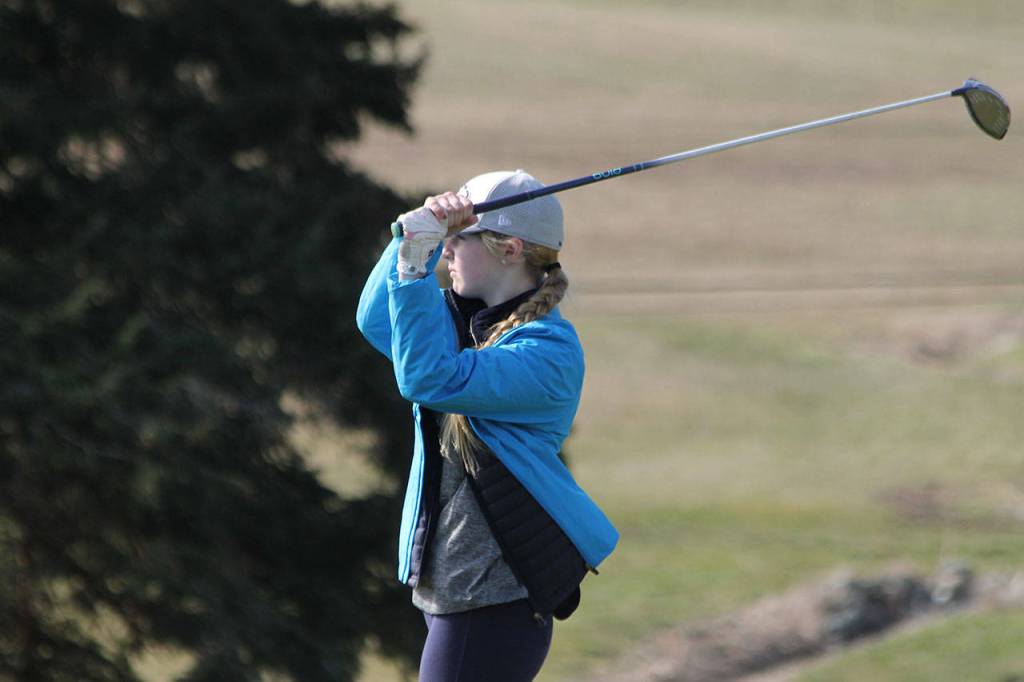 Caitlin Sullivan follows her first tee shot.(Photo by Jim Waller/South Whidbey Record)