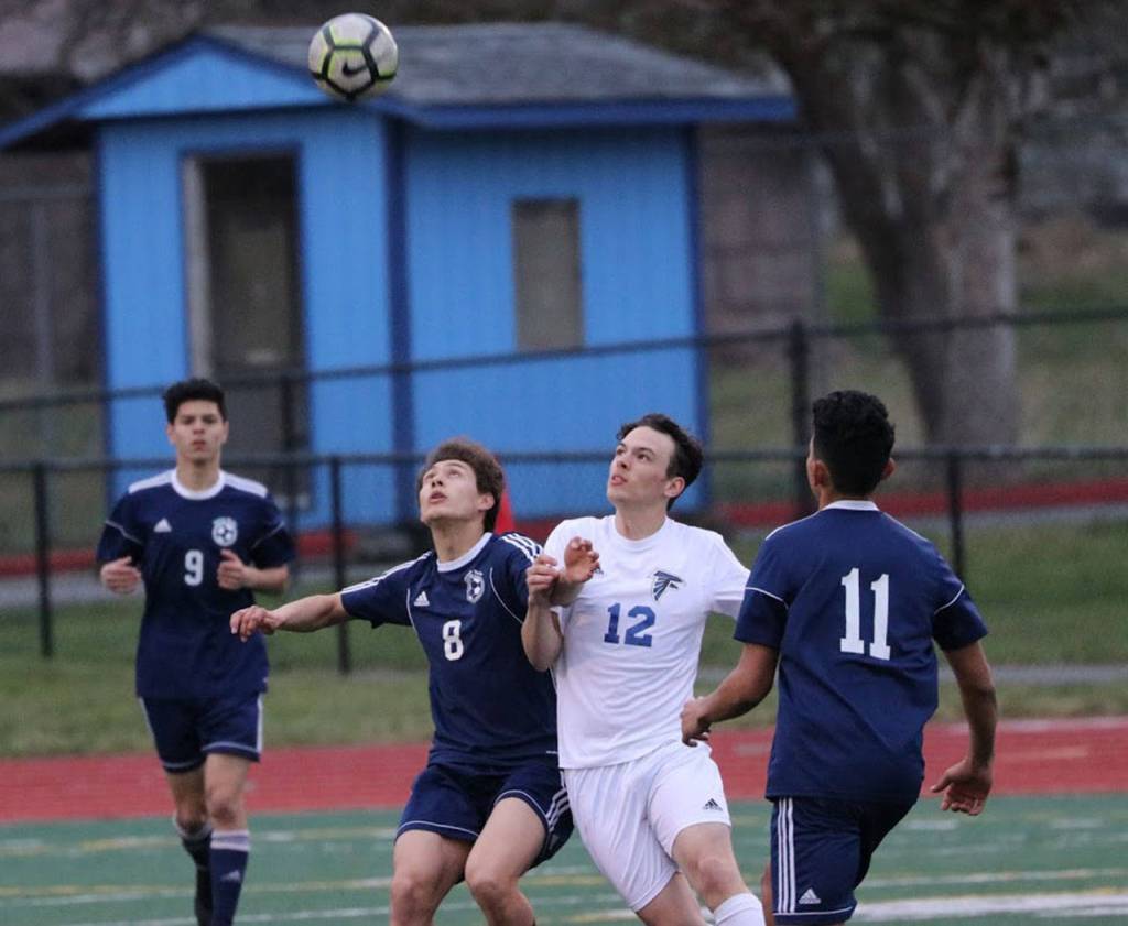 South Whidbeys Nevin Daniels (12) gets ready to challenge Sultans Pedro Alonso-Medina (8) for a 50/50 ball.(Photo by Matt Simms)