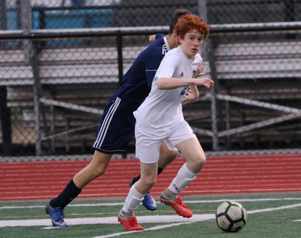 Aidan Donnelly looks for an open teammate in Wednesdays match.(Photo by Matt Simms)