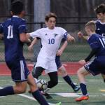 South Whidbeys Michael Lux (10) draws a crowd at Sultan Wednesday. Lux scored four goals in the Falcons 7-1 win.(Photo by Matt Simms)