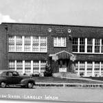 Part of the exhibit in the main hall, a photograph shows the old Langley High School in the late 1940s.