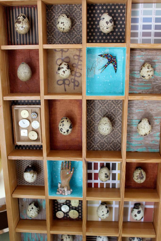 Sara Saltee assembled this shadow box as she anticipates her daughter leaving the nest. This is my letting go piece, she said. She painted quail eggs and found bird images and wristwatch faces at an antique store in La Conner.