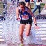 Kaia Swegler Richmonds splashes through the water pit while winning the steeplechase at the Holder Relays Saturday.(Photo by Karen Swegler)