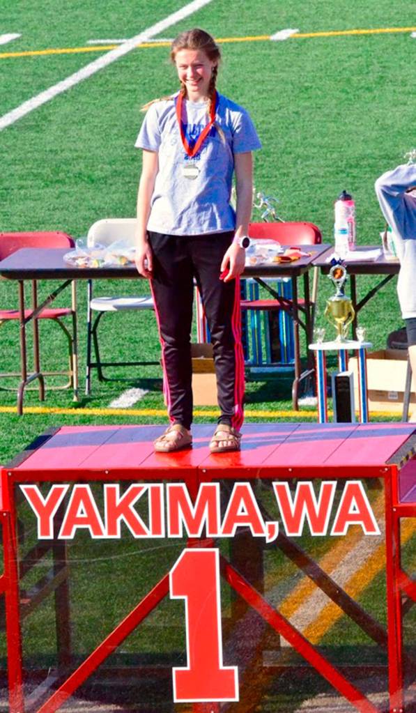 Kaia Swegler Richmond stands on the top of the podium after winning the steeplechase.(Photo by Karen Swegler)