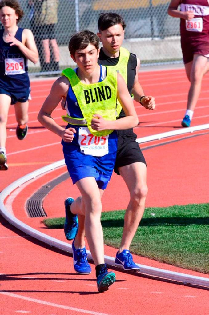 Luc Gandarias, left, and guide Scott Warwick compete in the 800 meters Saturday.(Photo by Karen Swegler)