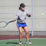 Farriss Jokinen returns a shot in her first singles win. (Photo by John Fisken)