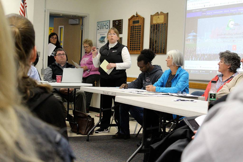 School board member Shawn Nowlin answers a question about the numerous duties of administators during a packed community forum Wednesday evening in Langley.