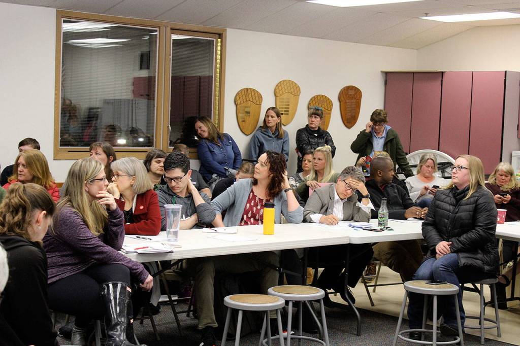 South Whidbey School District Superintendent Jo Moccia (far right, end of table) takes notes during Wednesdays two-hour exchange of questions and answers between community members and the board of education.
