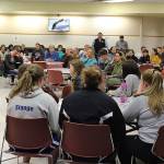Superintendent Jo Moccia vowed to work with the community toward solutions to critical cultural issues, such as cyber bullying and racism, during the second large gathering of concerned residents, students and staff over the past week. A table full of juniors seated in the front of the room asked several questions. (Photo by Patricia Guthrie/Whidbey News Group)