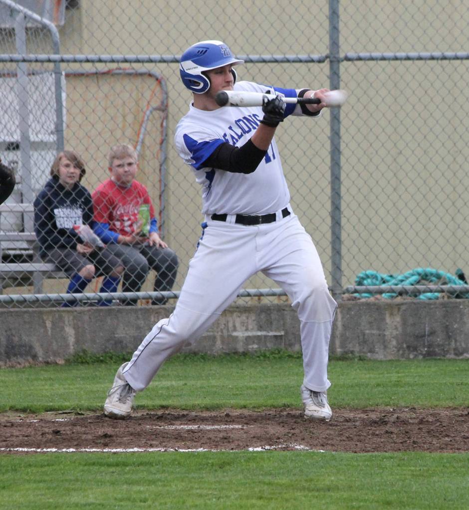 Brent Batchelor puts down a squeeze bunt to drive in South Whidbeys first run.(Photo by Jim Waller/South Whidbey Record)