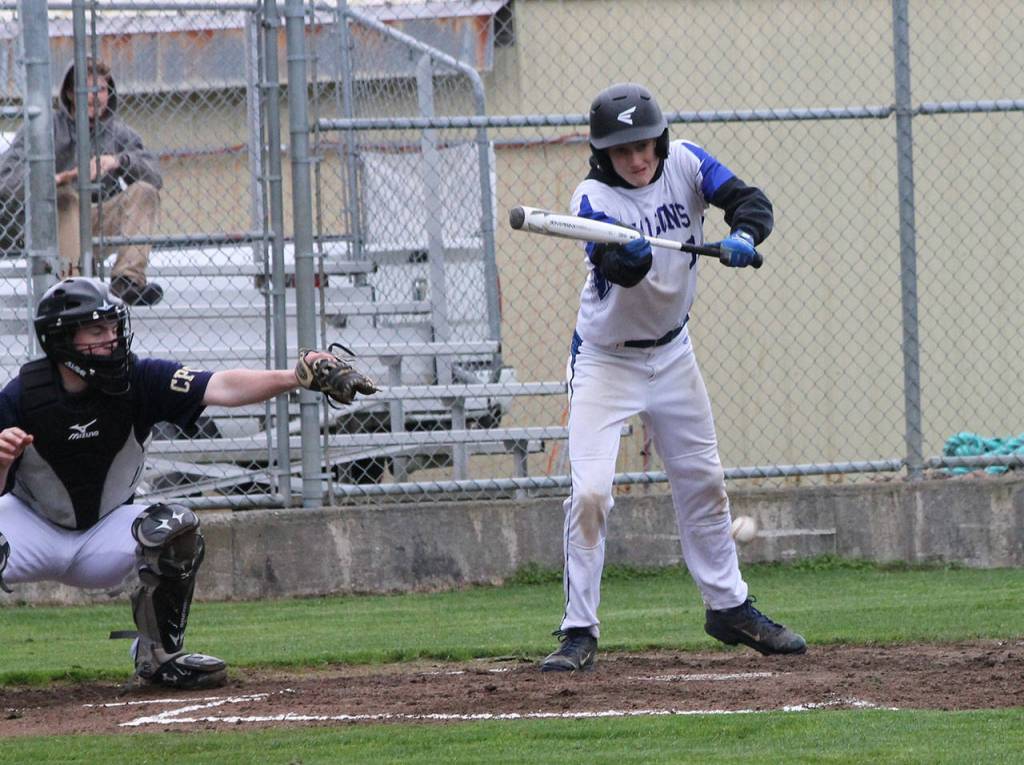Kody Newman moves two runners up with a sacrifice bunt.(Photo by Jim Waller/South Whidbey Record)
