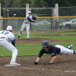 South Whidbey pitcher Ethan Petty throws to first baseman Brent Batchelor in an attempt to pick off a Cedar Park Christian runner.(Photo by Jim Waller/South Whidbey Record)