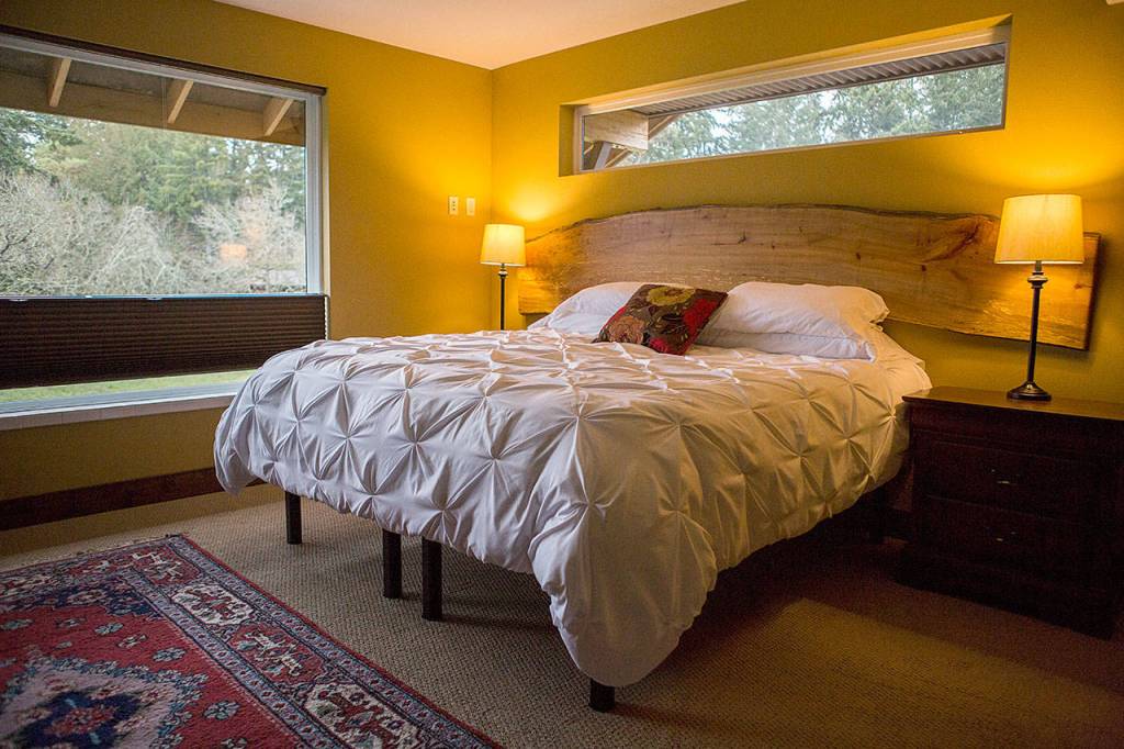 One of six rooms on the top floor at Comforts of Whidbey. The beds are dressed with handmade quilts. (Olivia Vanni/The Herald)
