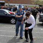 Senior Aryeh Rohde stumbles from the mock fatal car crash as the drunk teenage driver while hundreds of classmates and staff watched in front of South Whidbey High School Thursday. In pursuit is Trooper Dave Martin of the Washington State Patrol. (Photos by Patricia Guthrie/South Whidbey Record)