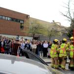 Many South Whidbey rescue agencies participated in the mock emergency response scene designed to remind teens that driving while impaired or distracted can be deadly. Law enforcement officers placed scattered empty beer bottles and a drained liquor bottle atop the roof of the mangled car while investigating.
