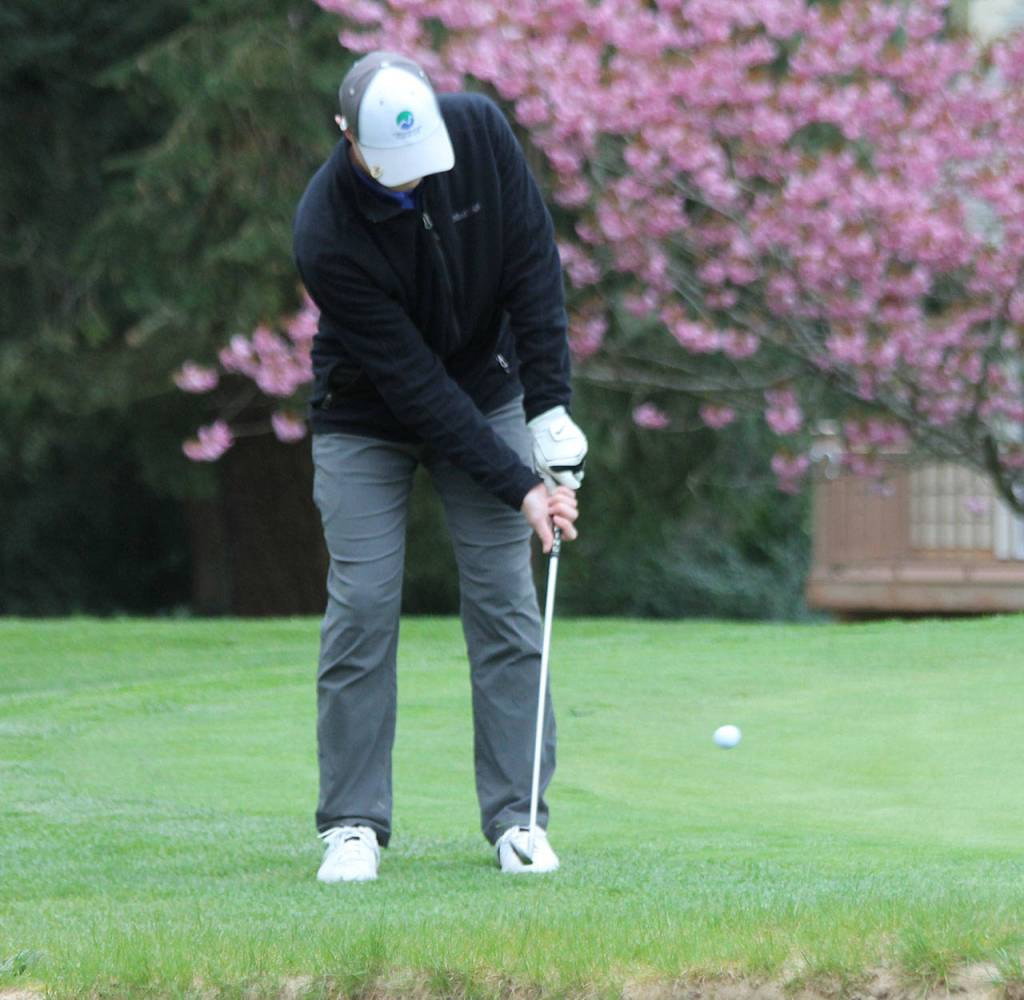 Brady Hezel chips from the fringe.(Photo by Jim Waller/South Whidbey Record)