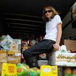 Spencer Jonas sits atop more than four tons of food he collected for his annual birthday food drive for Good Cheer Food Bank. (Photo by Patricia Guthrie/Whidbey News Group)