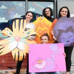 From left, student Pride and Allies Club members Madison Rixe, Tamika Nastali and Kalasya Hart and advisor Tacy Bigelow show off Alice in Wonderland-themed decorations for this years Rainbow Prom. (Photo by Laura Guido/Whidbey News Group)