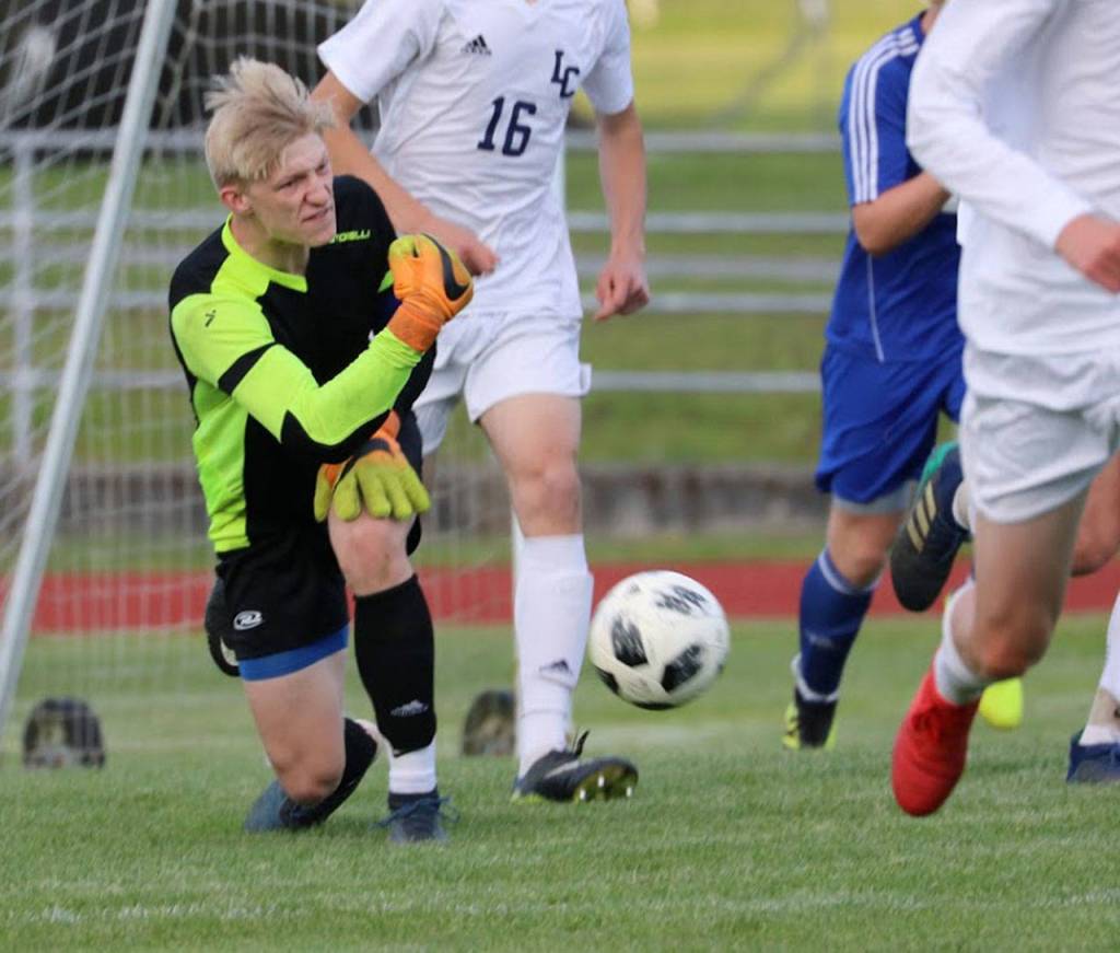 South Whidbey keeper Julian Inches passes the ball forward for the Falcons.(Photo by Matt Simms)