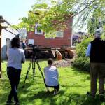 Whidbey Telecom moved its historic building Tuesday and wedged it in between the South Whidbey History Museum and its Big Gig Center. Backing it into the lot was challenging but the moving company, Nickel Bros. of Marysville, cut the corners just right.(Photo by Patricia Guthrie/Whidbey News Group)