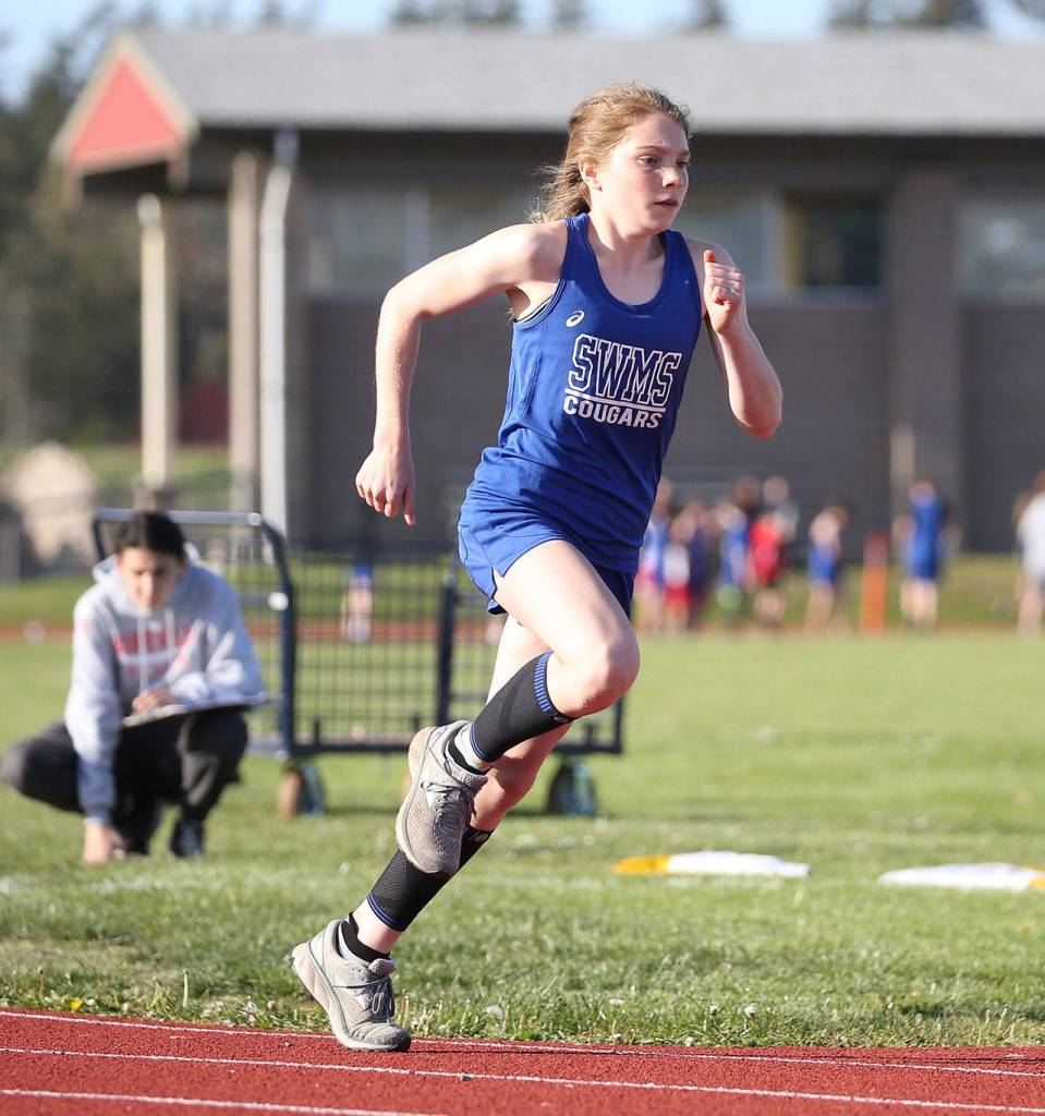 Photos: Cougars win 3-team meet / Middle school track