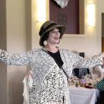 Patricia Duff, a spokeswoman for WhidbeyHealth, shows off a selection of items available at the hospital gift shop. The Polly Harpole Hospital Guild held its annual fashion show fundraiser Thursday at Whidbey Golf Club. Photo by Laura Guido/Whidbey News-Times