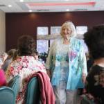 Sarah Cash of the Polly Harpole Hospital Guild models gift shop clothing Thursday afternoon at the nonprofits annual fundraiser. Photo by Laura Guido/Whidbey News-Times