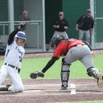 Drew Fry avoids the tag to score for South Whidbey. (Photo by Jim Waller/South Whidbey Record)