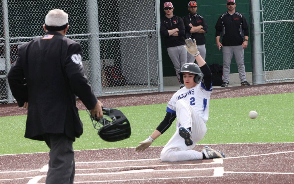 Luke Rookstool hustles home for a South Whidbey run.(Photo by Jim Waller/South Whidbey Record)