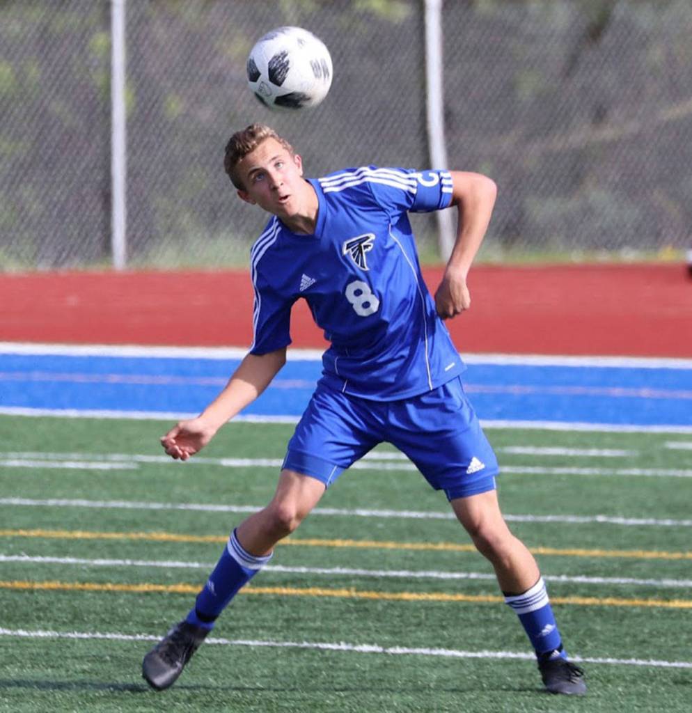 Joey Lane heads the ball forward for the Falcons.(Photo by Matt Simms)