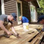 South Whidbey Hearts & Hammers volunteers, including house captain Ken Murray, center, work on a project Saturday. (Photo provided)