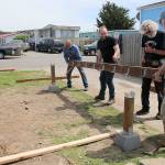 Volunteers from Central Whidbey Hearts Hammers work on building a deck. From left to right are Chuck Hathaway, Devin Short, house captain Gary Wray and Dave Park. (Photo by Maria Matson/ South Whidbey Record)