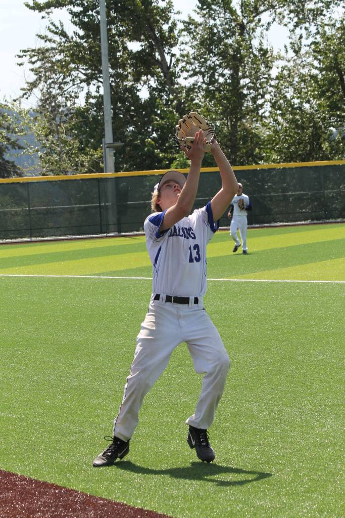 Third baseman Drew Fry settles under a foul pop-up.(Photo by Jim Waller/South Whidbey Record)