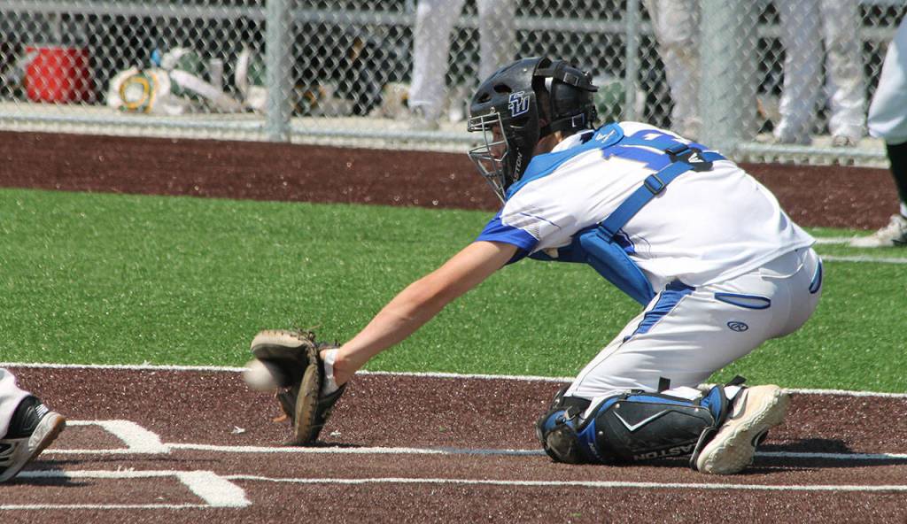 Catcher Dexter Jokinen backhands a low pitch.(Photo by Jim Waller/South Whidbey Record)
