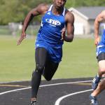 Carl Henri Chapman runs the 200 meters for the Falcons. (Photo by John Fisken)