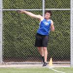 Dylan Davis tosses the discus at the district meet.(Photo by John Fisken)