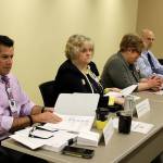 Ron Telles, left, received a one-year contract as the new CEO of WhidbeyHealth at a Monday board meeting. (Photo by Patricia Guthrie/Whidbey News Group)