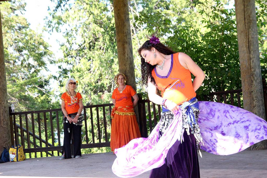 Photo by Laura Guido/Whidbey News-Times                                Belly dance teacher Chandani Teresa Ortego performs a solo dance Saturday at Coupeville Town Park as part of the 2019 Shimmy Mob.