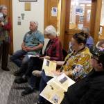 <div>At a Freeland Library presentation Wednesday, Judith Gorman shows some of her sons photographs included in the book, A Soldiers Journal, Last Supper to No Goodbye. (Photo by Patricia Guthrie/Whidbey News Group)</div>