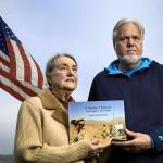Judith Gorman and Perry McClellan hold the book compiled from the personal writings of their son Orrin, who killed himself after struggling with post-traumatic stress disorder and other injuries sustained during 2005-2006 Afghanistan combat. The former Langley couple have moved to Soap Lake where they always keep their flag at half-staff in front of their home. (Photo provided)