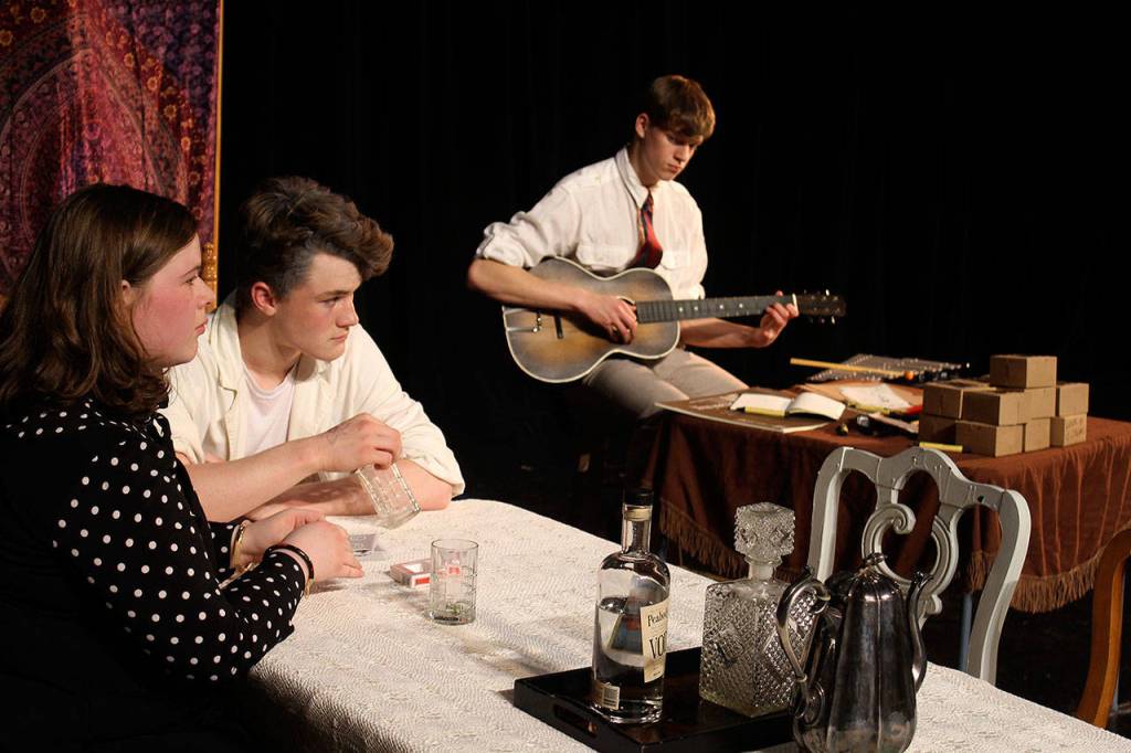 South Whidbey High School students rehearse scenes for the play, You Cant Take It With You.                                Alexa Wright, left, Caleb McArthur, center, and Steven Osborn. (Photo by Patricia Guthrie/Whidbey News Group)