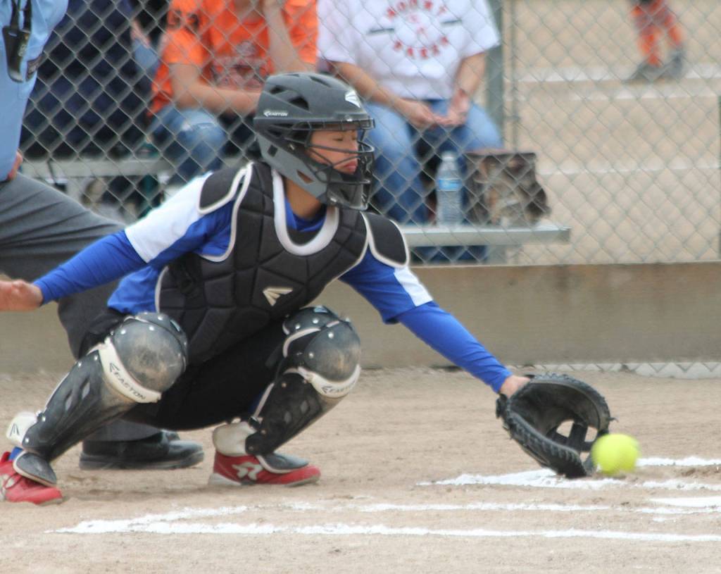 Catcher Ari Marshall scoops up a low pitch.(Photo by Jim Waller/South Whidbey Record)