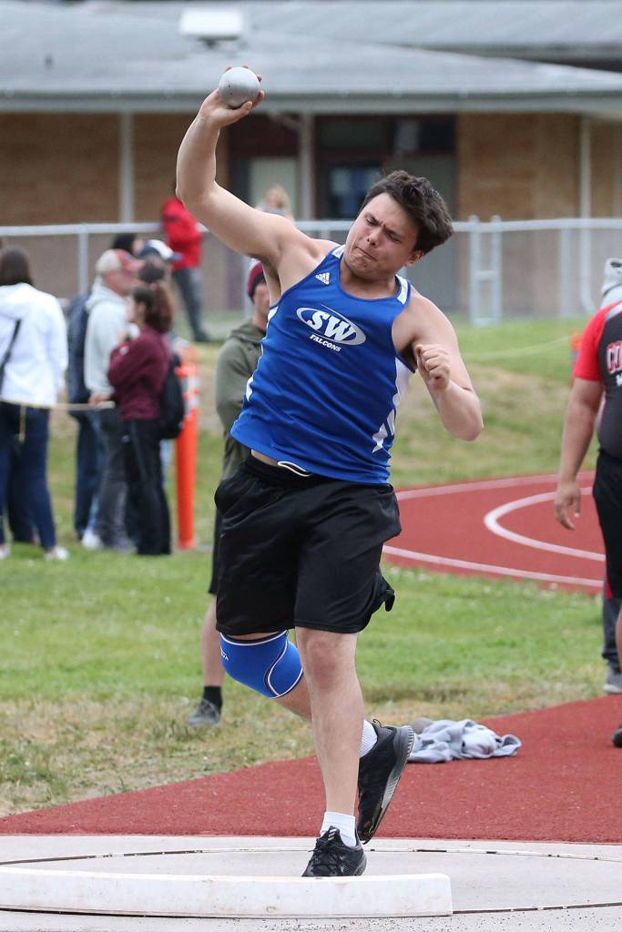 Dylan Davis heaves the shot put at bi-district.(Photo by John Fisken)