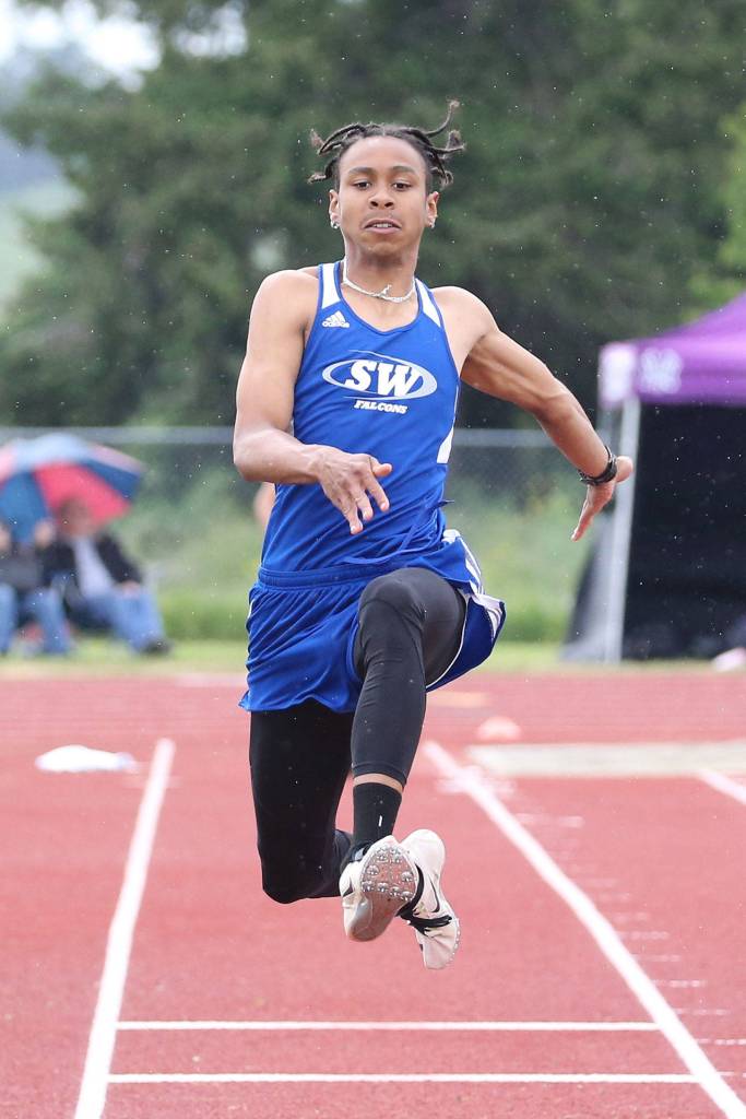 Issiah Gonzales flies to third place and a state berth in the triple jump. He also earned a state berth by winning the high jump.(Photo by John Fisken)