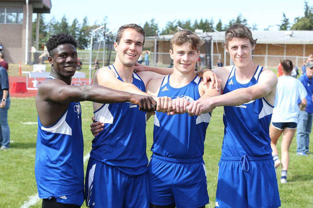 The bi-district championship 4x400 team includes Carl Henri Chapman, left, Max Dodd, Bodie Hezel and Callahan Yale.(Photo by John Fisken)